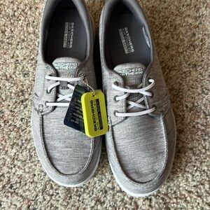 Sketchers, never worn with tags. Comfort shoe. Light gray. Size 8.